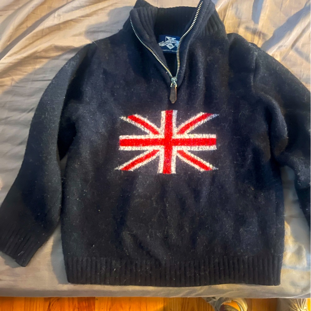 Slightly pitted wool sweater. Great quality. Fits well on a small 7 yr old boy.